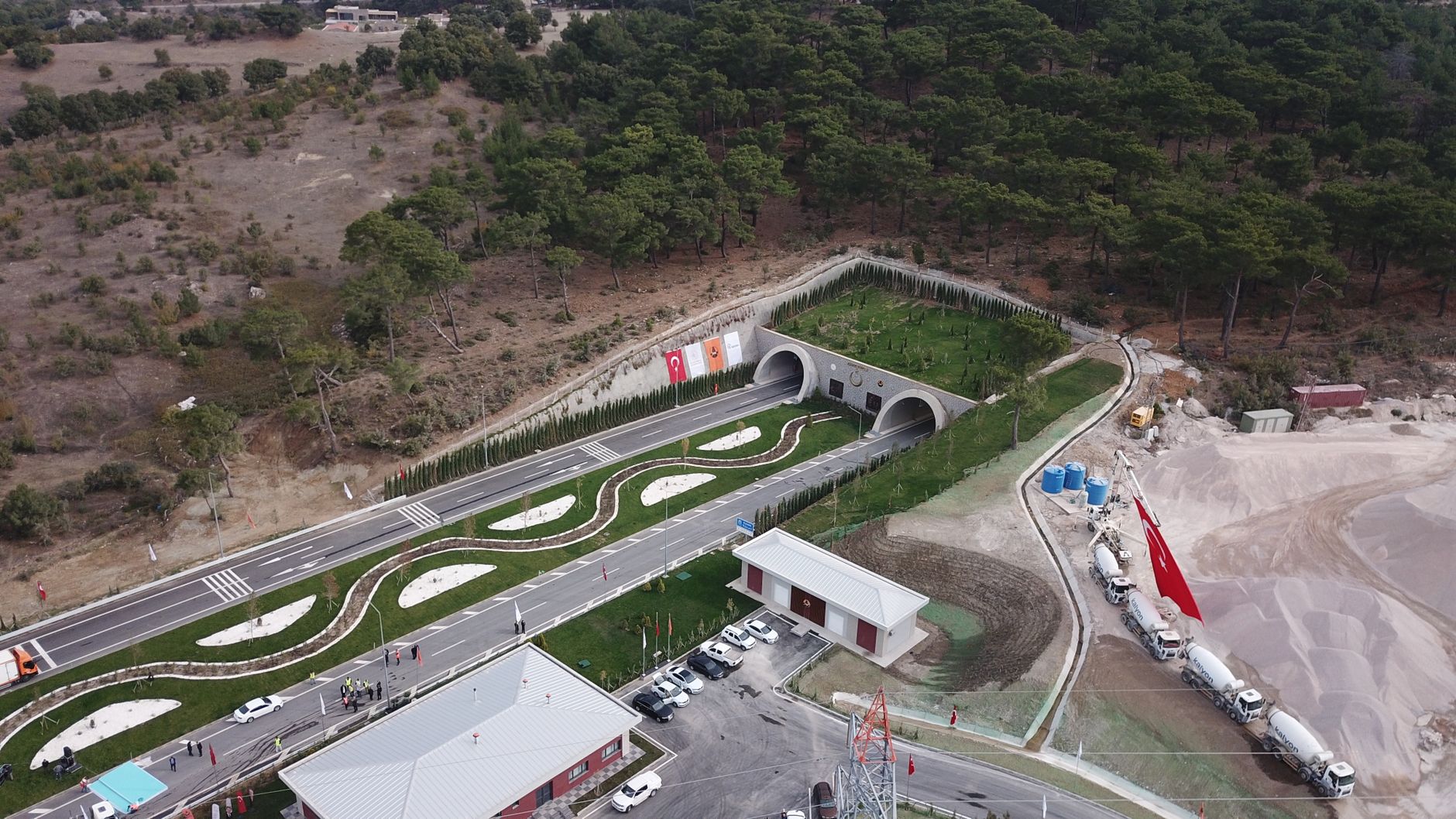 Aerial shot of a tunnel entrance surrounded by greenery in Yeniçam, Turkey. — Enjoy the Thrill of Online Baccarat Anytime, An